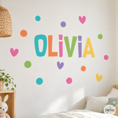 Vinil infantil personalitzat amb nom i cors de colors per decorar la paret d’una habitació infantil
