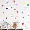 Vinilo confeti acuarela en pared infantil con colores suaves estilo pastel