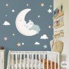 Baby bear sleeping on turquoise moon wall decal with clouds and stars, nursery wall decoration
