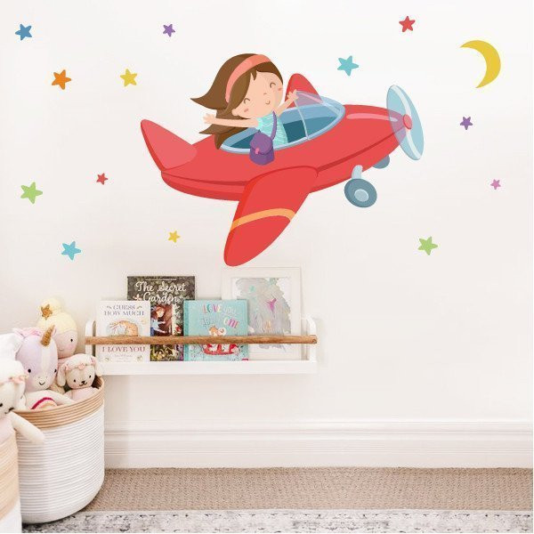 Decoración infantil - Niña viajando en avión - Vinilos decorativos