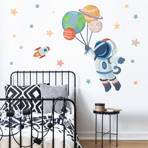 Vinilos infantiles - Astronauta con planetas - Decoración habitaciones infantiles