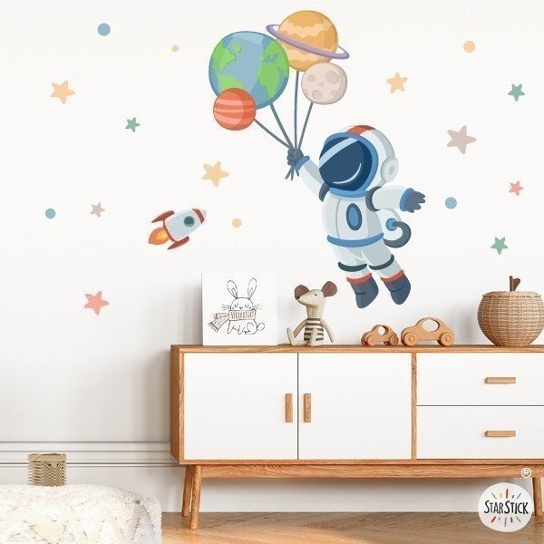 Vinils infantils - Astronauta amb planetes - Decoració habitacions infantils