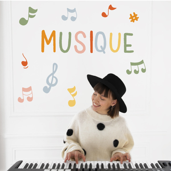 Vinil decoratiu amb la paraula Música + notes musicals