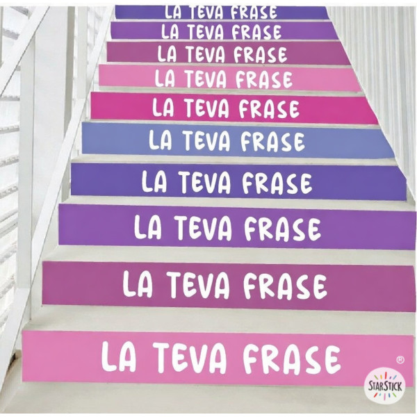 Vinils decoratius a les escales d’un col·legi amb frases motivadores en color lila.