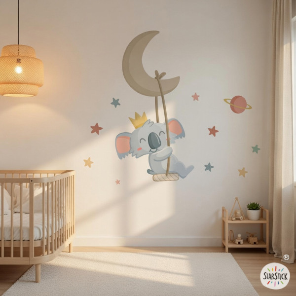 Children’s wall decal featuring a koala on the moon with a swing in the baby room
