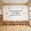 Sticker mural avec la phrase « Je veux, je peux et je le ferai » entourée d’étoiles.