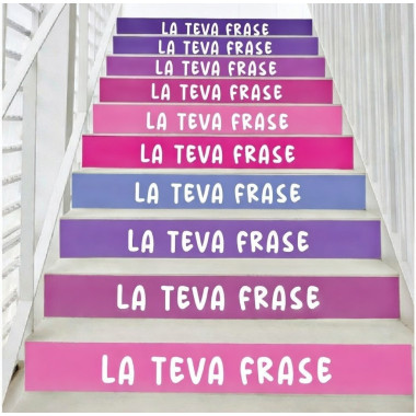 Vinils decoratius a les escales d’un col·legi amb frases motivadores en color lila.
